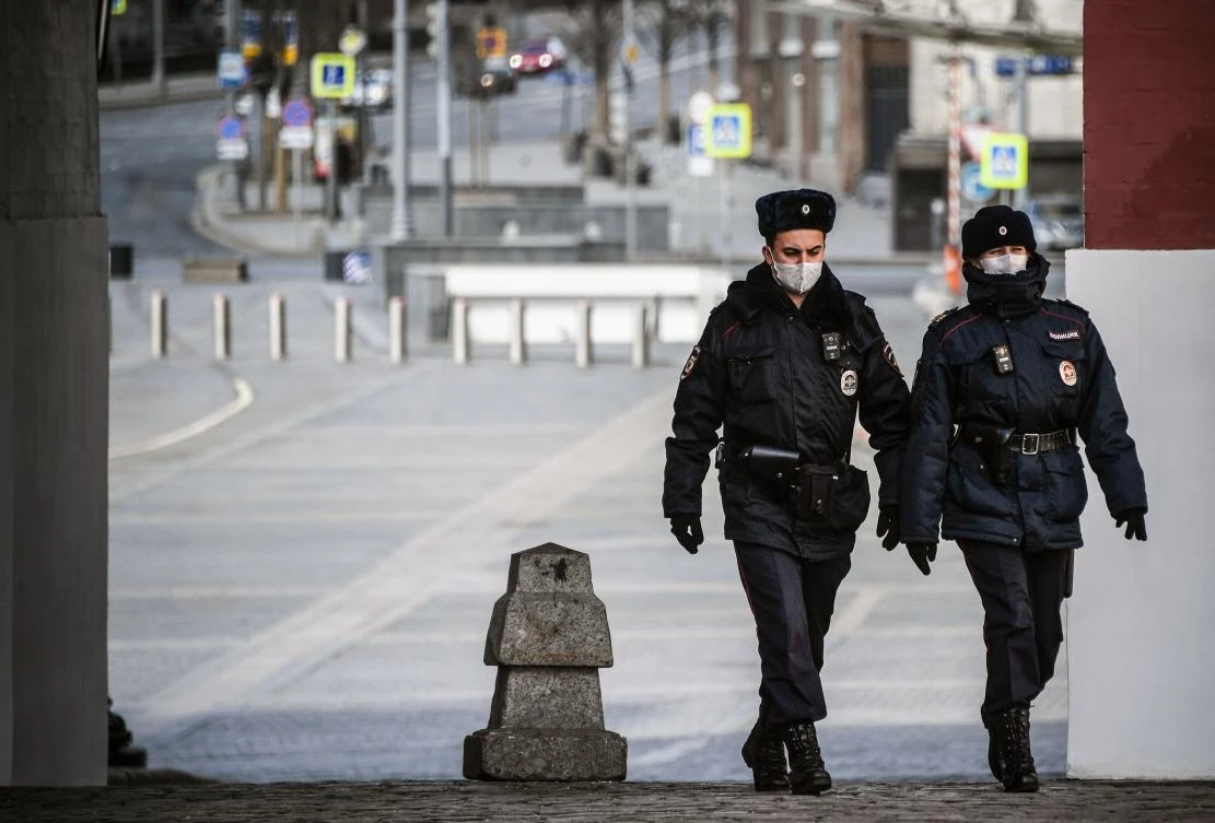 Police officers patrol a deserted downtown Moscow on April 6, 2020, amid the spread of the coronavirus. (AFP)
