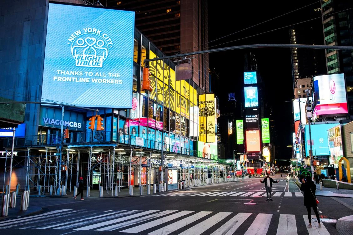 Above, people walk in Times Square, Manhattan. Total number of US fatalities linked to the virus now stands at 16,478. (Reuters)