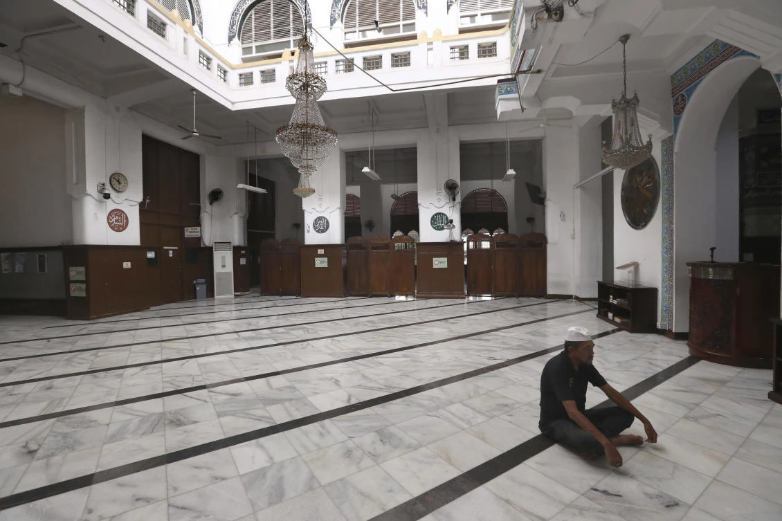 A man prays at an empty mosque in Jakarta, Indonesia, Friday, April 10, 2020. (AP)