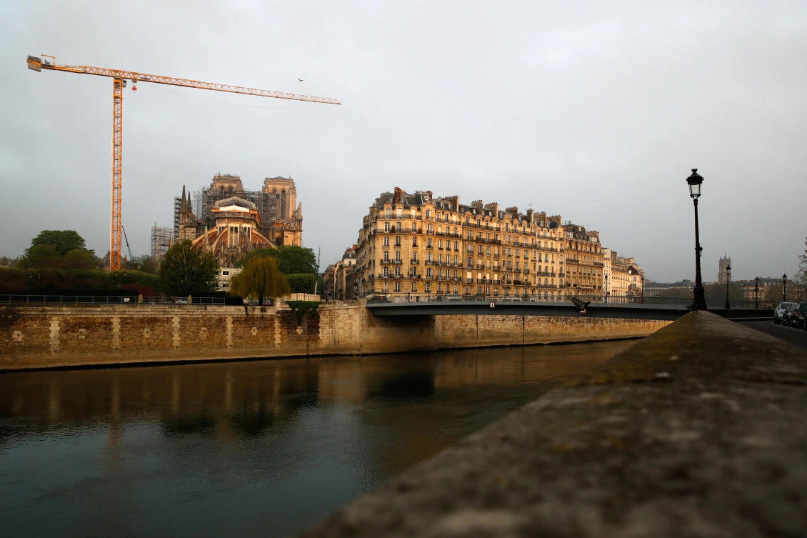 A view shows a giant crane near Notre Dame Cathedral, which was damaged in a devastating fire almost one year ago, in Paris ahead of Easter celebrations to be held under lockdown imposed to slow the spread of the coronavirus disease (COVID-19) in France, April 7, 2020. (Reuters)