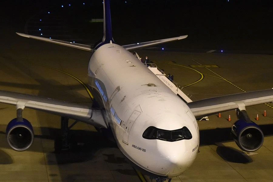 Passengers evacuated from the coronavirus-stricken Australian liner Greg Mortimer board the medically equipped plane that will fly Australian and New Zealander nationals to Melbourne, at Carrasco International Airport early on April 11, 2020 . (File/AFP)