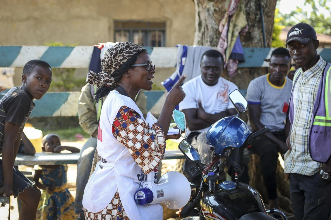 In this photo taken Tuesday, April 7, 2020, Katungo Methya, 53, who volunteers for the Red Cross educating the public about epidemics, talks about coronavirus prevention in Beni, eastern Congo. (AP)