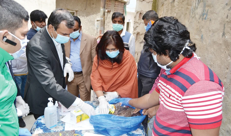Bangladesh Ambassador to Jordan Nahida Sobhan distributes food to migrants in Amman. There are around 150,000 Bangladeshi migrants in Jordan. (Supplied)
