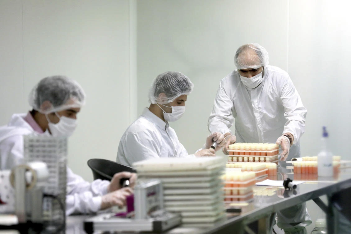 Medical firm staff work in a lab on coronavirus testing kits just outside Tehran, Iran, Saturday, April 11, 2020. (AP)