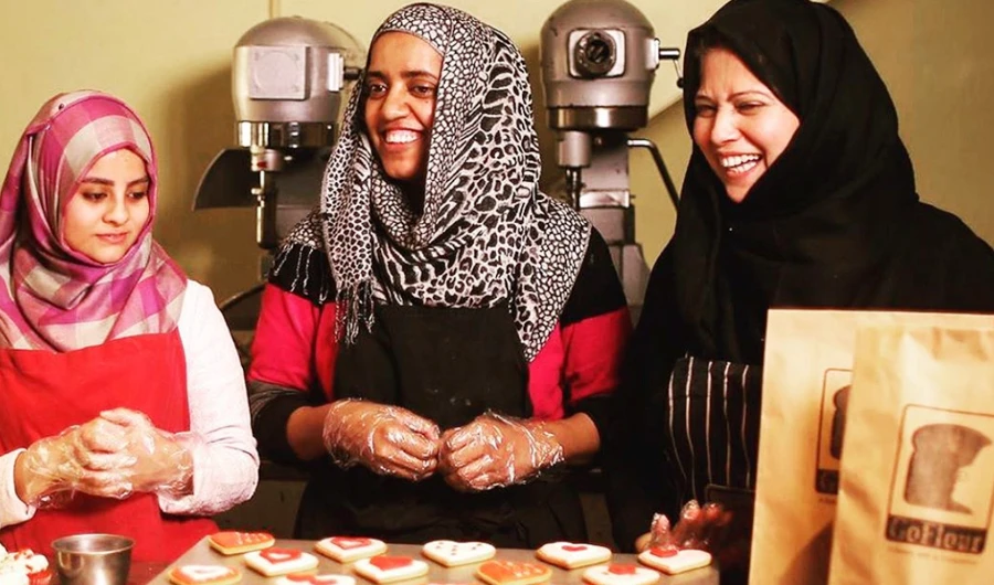 Workers at Lahore’s Go Flour bakery share a light moment while at work. (Photo courtesy: Go Flour)