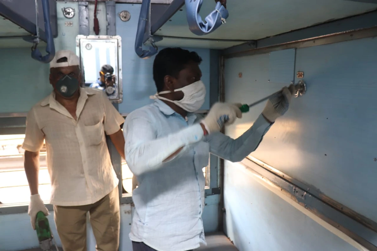 Staffers work round the clock to convert the coach into an isolation unit by removing the middle berth in a train compartment. (Indian Railways)