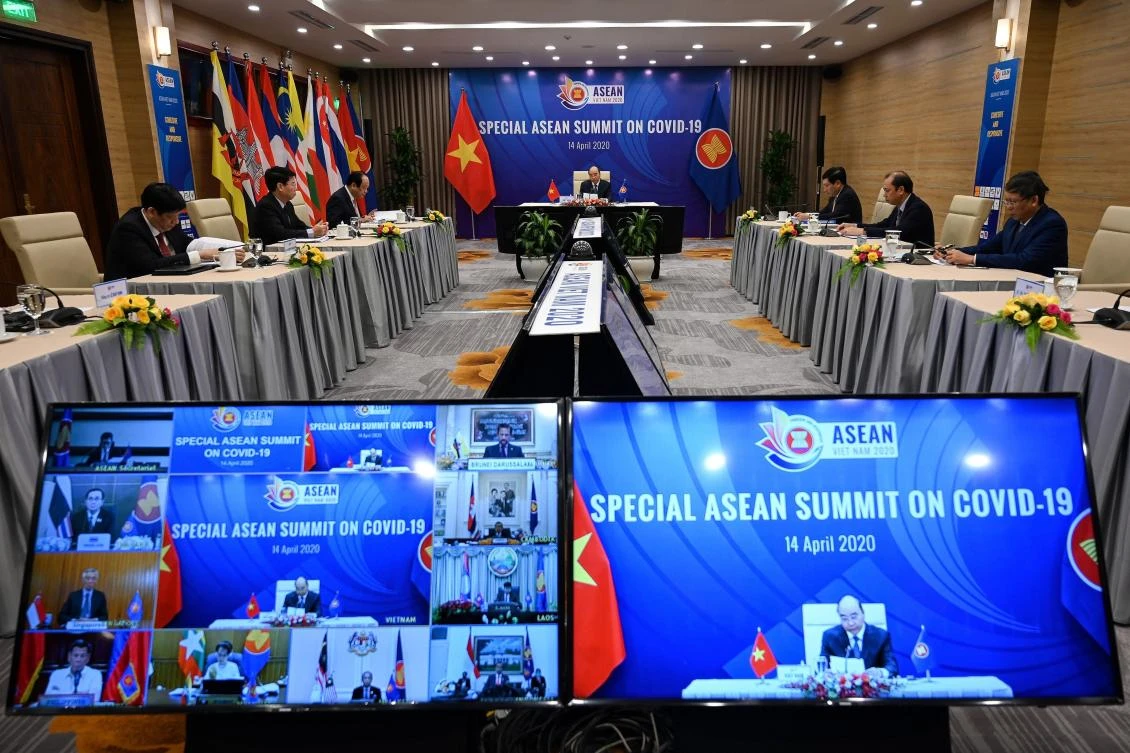 Vietnam’s Prime Minister Nguyen Xuan Phuc, center, addresses a live video conference on the special Association of Southeast Asian Nations summit on the coronavirus pandemic in Hanoi on April 14, 2020. (AFP)