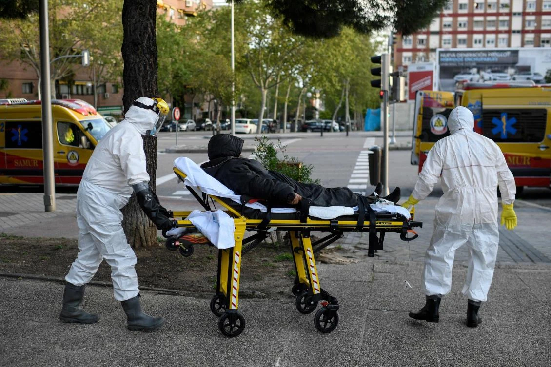 Confirmed coronavirus infection cases in Spain rose by 3,045 to 172,541. Above, paramedics wheel a homeless man suspected of being infected with coronavirus in Madrid on April 11, 2020. (AFP)