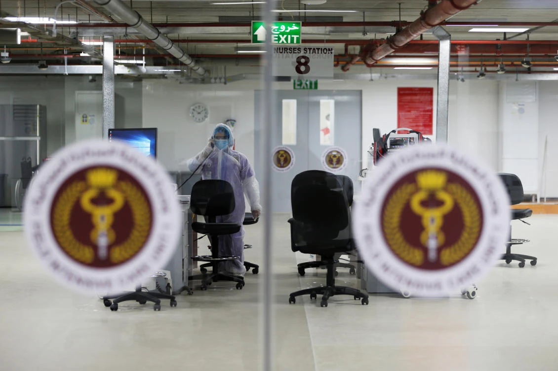 A doctor is seen working inside the Step Down Unit of a makeshift ICU "Field Intensive Care Unit 1" set up by Bahrian authorities to treat the coronavirus disease (COVID-19) critical patients, at a car-park of Bahrain Defence Force Hospital in Riffa, Bahrain, April 14, 2020. (Reuters)
