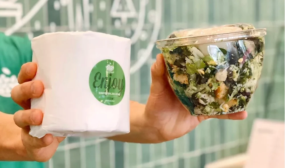 What started as a joke to keep customers at Simply Salad smiling has become a community service sensation - serving toilet roll with an order. (Simply Salad)