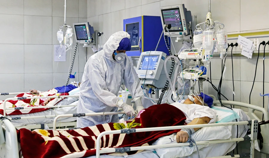 In this March 1, 2020 file photo, a medic treats a patient infected with coronavirus, at a hospital in Tehran, Iran. (AP)