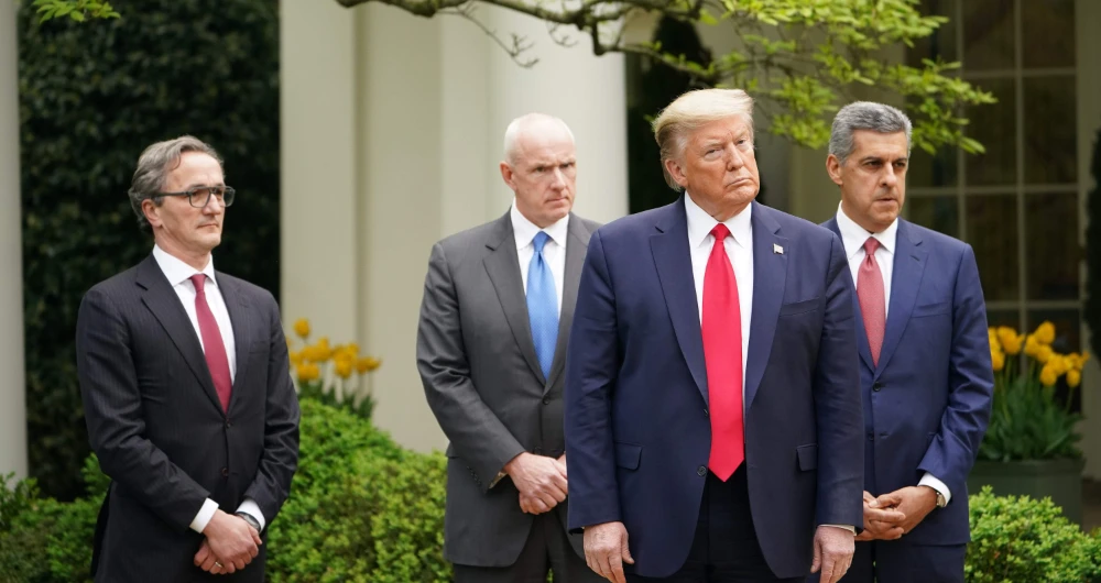 US President Donald Trump stands with Healthcare CEOs during the daily briefing on the novel coronavirus, which causes COVID-19, in the Rose Garden of the White House on April 14, 2020, in Washington, DC. (AFP)