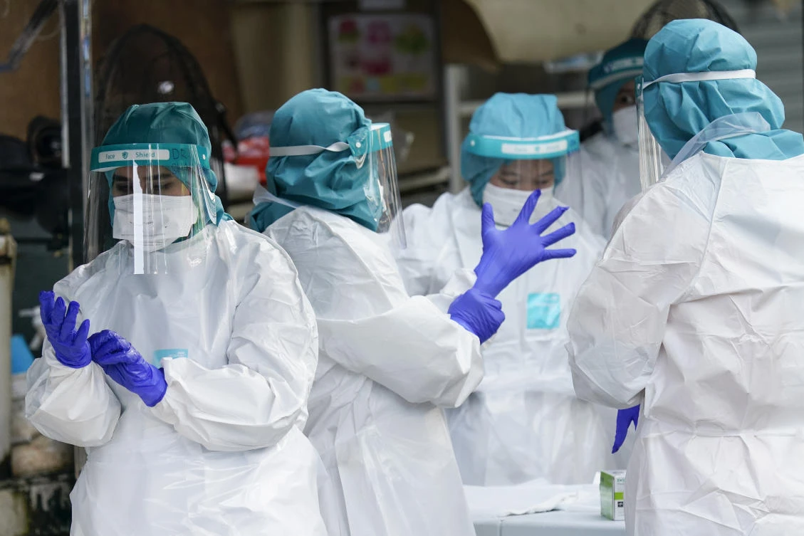 Malaysian health workers prepare to conduct a COVID-19 test for residents at Kampung Baru, a traditional Malay village in Kuala Lumpur on Wednesday, April 15, 2020. (AP)
