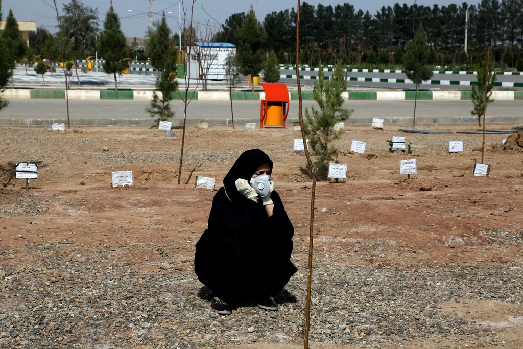 A woman mourns during a funeral held at Beheshte Masoumeh Cemetery for a victim of coronavirus in Qom, Iran, on March 17, 2020. (Getty Images)