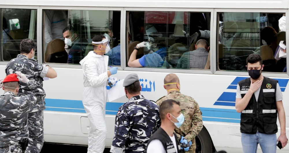Thousands of people have registered with Lebanese embassies around the world to return home because of the COVID-19 outbreak. (AFP)