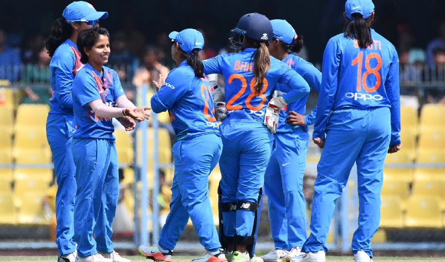 India's Poonam Yadav (L) celebrates with her teammates after taking the wicket of England's Natalie Sciver during the final match of the women's Twenty20 (T20) cricket series between India and England at the Barsapara Cricket Stadium in Guwahati on March 9, 2019. (AFP)