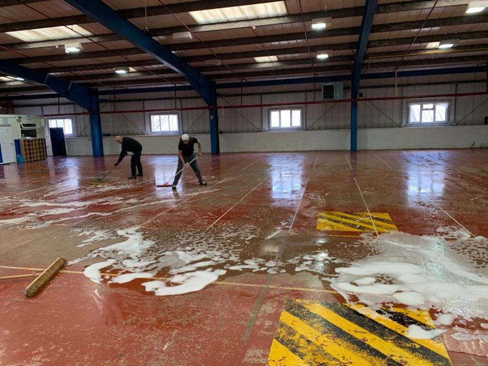 Volunteers clean and prepare the mosque hall. (Supplied)