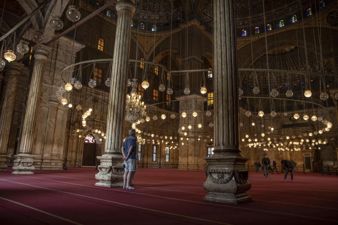 In this March 18, 2020, file photo, an American tourist looks at the great Mosque of Muhammad Ali Pasha at the Citadel complex, in Cairo, Egypt. (AP)