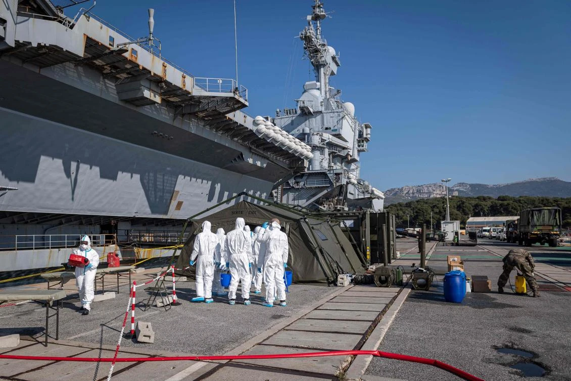 France defends handling of aircraft carrier coronavirus outbreak