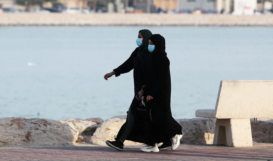Women wear protective masks as they walk in Qatif. (Reuters/File)