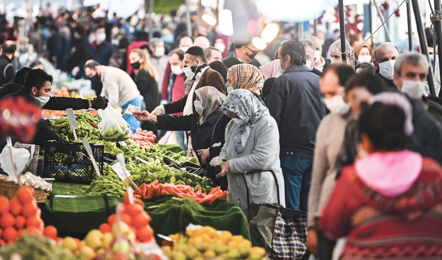 People do their grocery shopping at a market in Bayrampasa in Istanbul as Turkey adopts measures to curb the spread of the coronavirus. (AFP)
