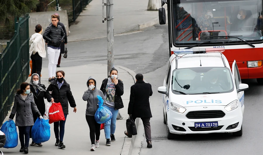 Prisoners walk at a bus stop after they were released from Bakirkoy Women's Prison to ease overcrowding in jails and avoid the possibility of a surge in coronavirus disease (COVID-19) cases, in Istanbul, Turkey, April 15, 2020. (REUTERS)