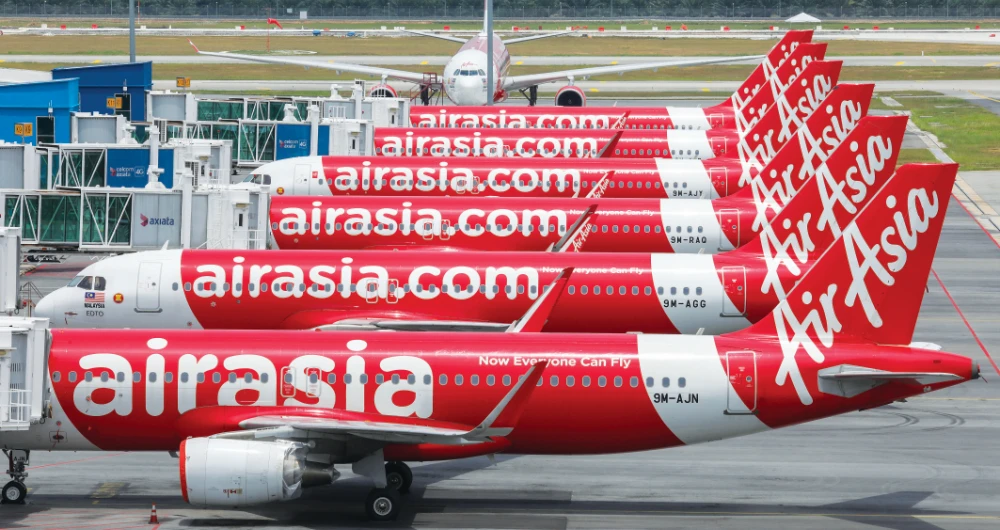 A merger with AirAsia is seen as a possible solution to save the ailing Malaysia Airlines. Both are struggling as a result of the collapse in the global airlines industry. (Reuters)