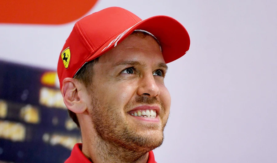 In this file photograph taken on March 12, 2020, Ferrari's German driver Sebastian Vettel smiles during a press conference at the Albert Park circuit ahead of the Formula One Australian Grand Prix in Melbourne. (AFP)