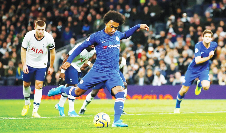Chelsea’s Brazilian star Willian scores a goal through a patently kick during a match between Chelsea and Tottenham Hotspur in London. (Reuters/File)
