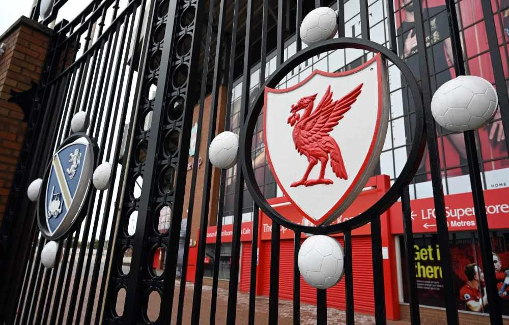 A picture shows the locked gate and emblem at Liverpool football club's stadium Anfield in Liverpool, England, on April 18, 2020. Premier League clubs remain committed to finishing the top-flight season but did not set a June 30 deadline to complete the fixture list. (AFP)