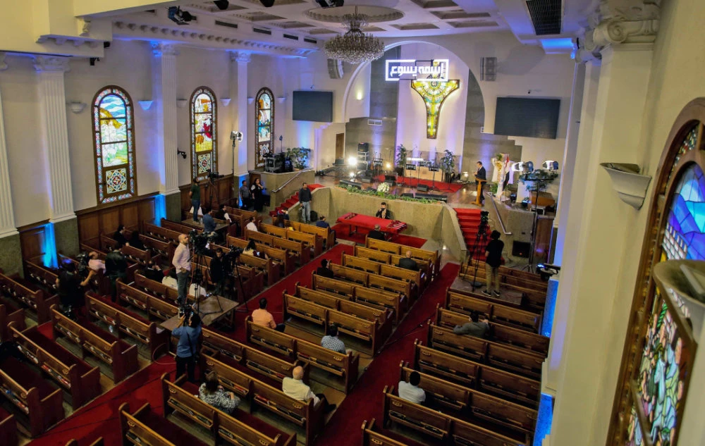 Christian Orthodox Egyptians attend a Bright Saturday service, amid the COVID-19 pandemic, at a church in the capital Cairo on April 18, 2020. (AFP)