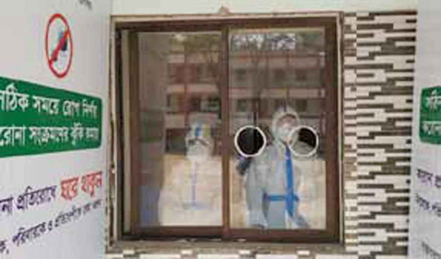 Health professionals at the sample collection booths on Sunday for COVID-19 patients in the Narayangonj area of Bangladesh..(Photo courtesy: JKG Healthcare)