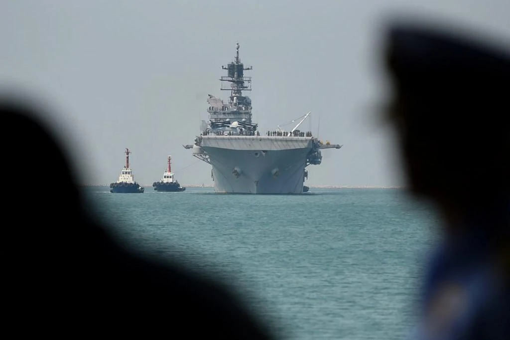 The USS America amphibious assault ship, above, has been deployed and were operating in the South China Sea. (AFP)