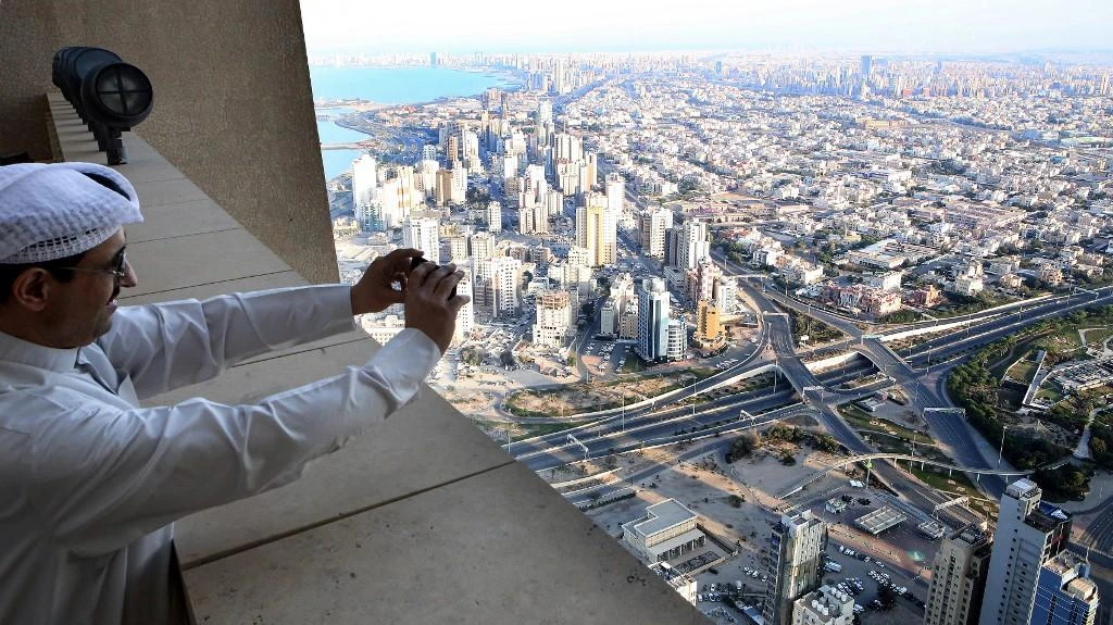 Above, a bird’s eye view of the empty streets in Kuwait City on March 24, 2020. Kuwait is helping SMEs with funding requirements. (AFP)