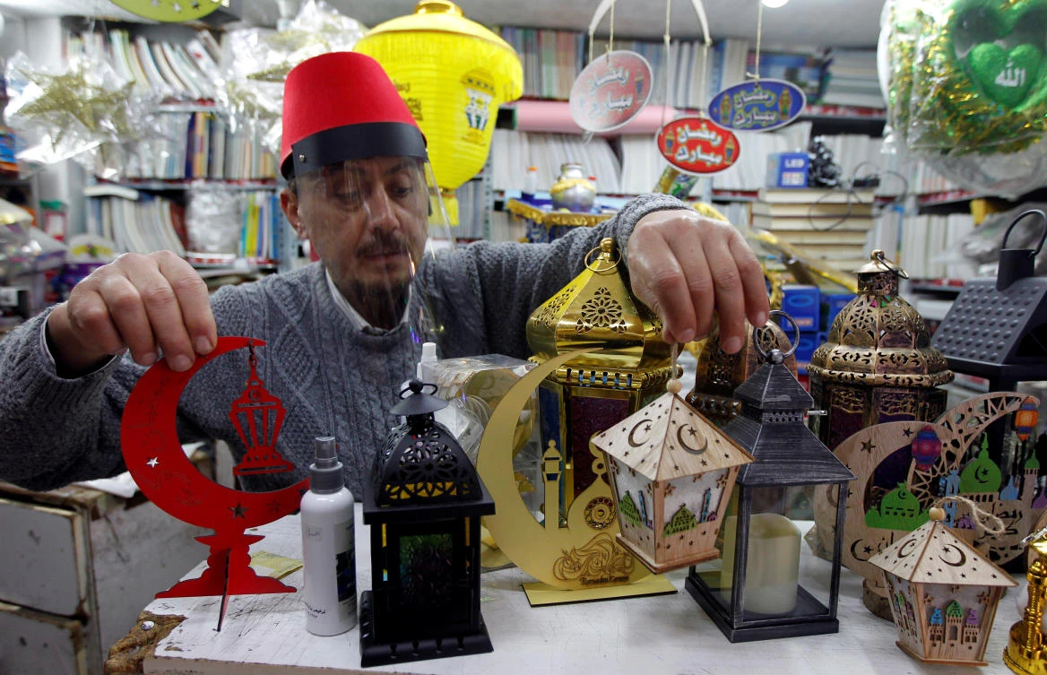 Lebanon has imposed an overnight curfew also bans going outside between 8 p.m. and 5 a.m., with security forces enforcing curbs. Above, a vendor sells traditional Ramadan lanterns ahead of the Muslim holy month of Ramadan. (Reuters)