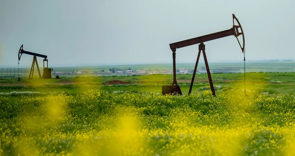 Analysts said the dire headwinds facing the sector would drive a coordinated response from OPEC and non-OPEC producers. (AFP)