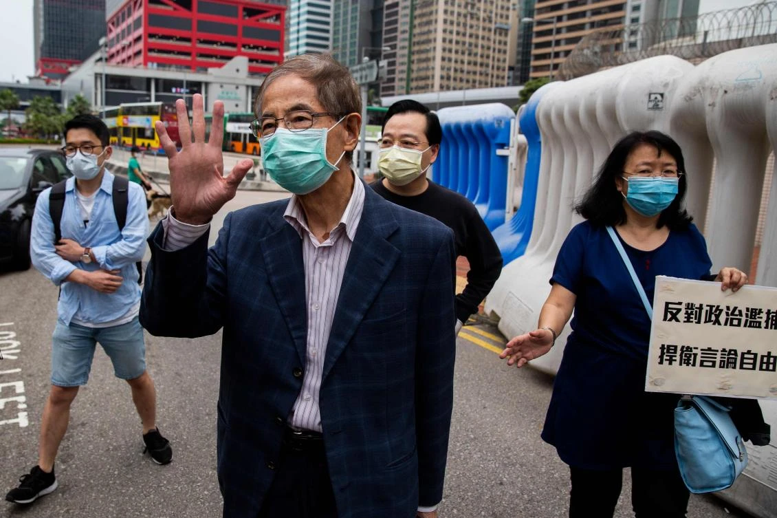 Former lawmaker and pro-democracy activist Martin Lee, center, leaves the Central District police station in Hong Kong, after being arrested and accused of organizing and taking part in an unlawful assembly in August last year in this April 18, 2020. (AFP)