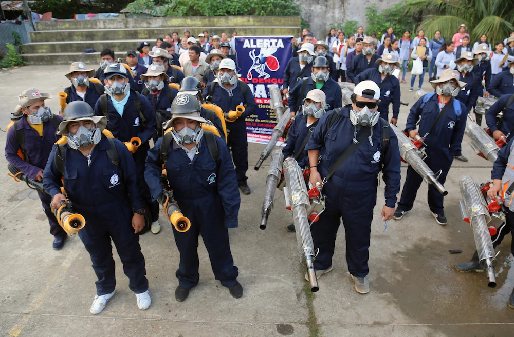 This February 8, 2020, image released by the Peruvian Ministry of Health shows a health workers preparing to fumigate mosquitos to stay Dengue fever, in the Madre de Dios region of Peru, 1,000kms (621 miles) east of Lima. (AFP/File Photo)
