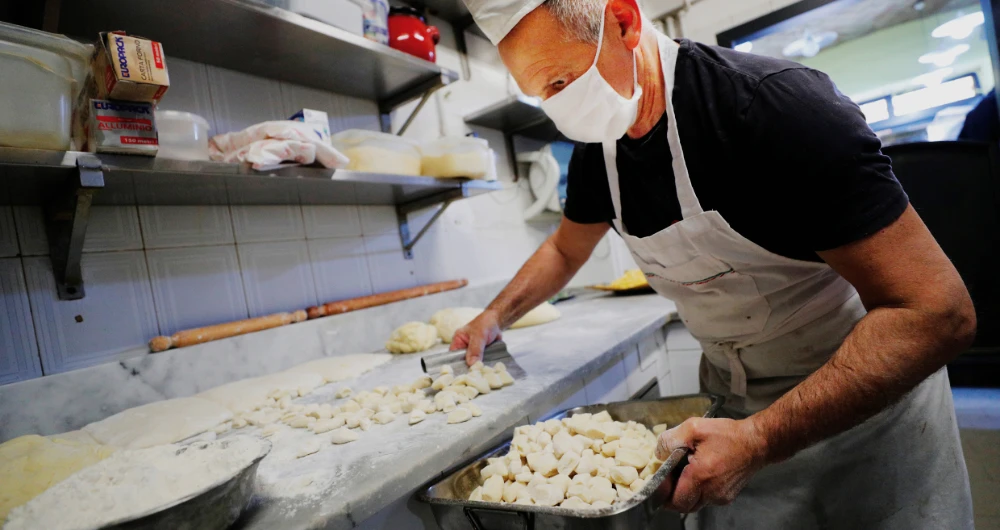 Ezio Di Carlo makes gnocchi after opening up his restaurant in Rome to carry out home deliveries. The money he earns is just about keeping his head above water. Ramadan is the time when eateries usually sees a jump in business. (Reuters)