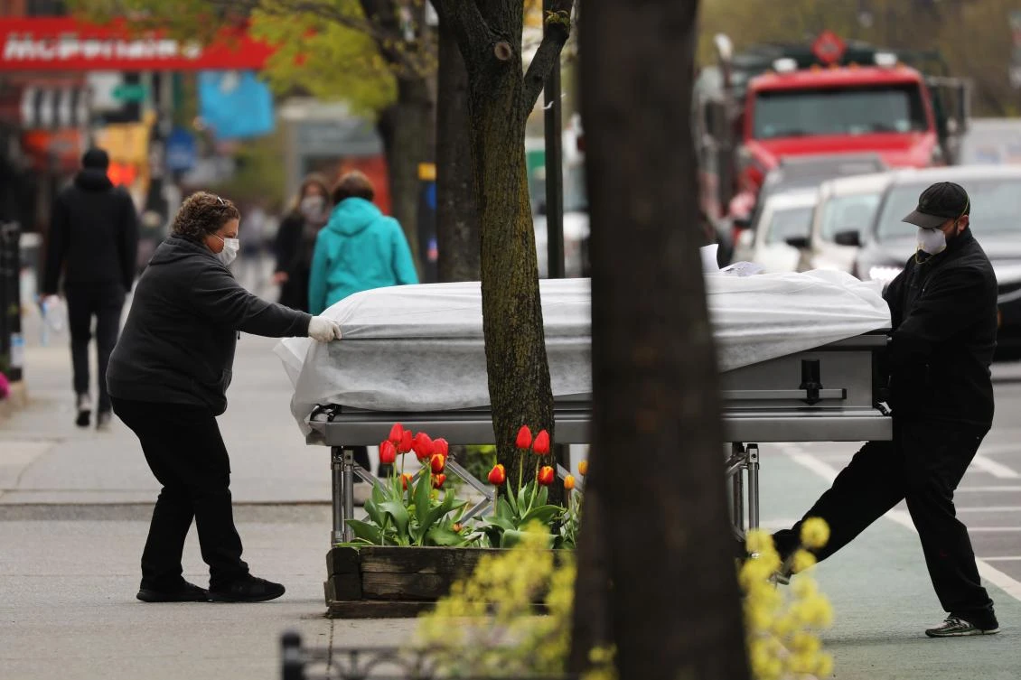 About 40 percent of the coronavirus-related deaths have happened in New York state. Above, a casket is delivered to a funeral home in Brooklyn on April 23, 2020. (Getty Images/AFP)