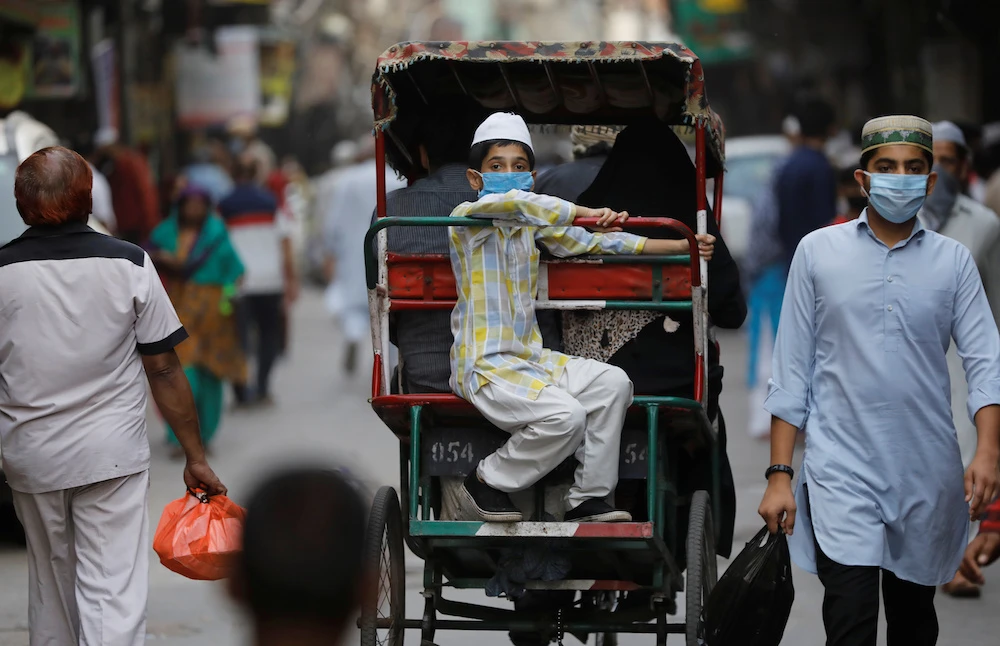 A Muslim boy in a cycle rickshaw on the eve of Ramadan, during a nationwide lockdown to slow the spread of coronavirus, in the old quarters of Delhi, India, April 24, 2020. (Reuters)