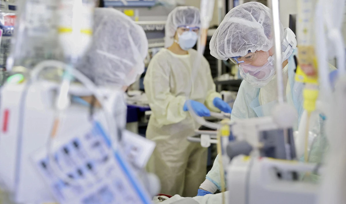 Medical workers treat a coronavirus patient in the ICU of St. Marianna Medical University Hospital in Kawasaki, Japan on April 23, 2020. (Kyodo via Reuters)