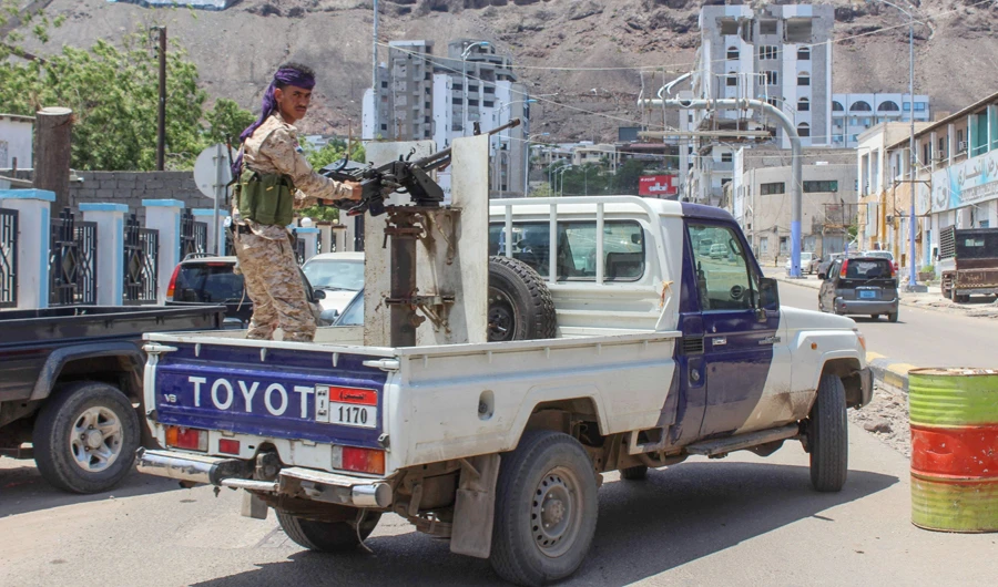A fighter with Yemen's separatist Southern Transitional Council (STC) mans a gun in the back of a vehicle deploying in the southern city of Aden, on April 26, 2020, after the council declared self-rule in the south. (AFP)
