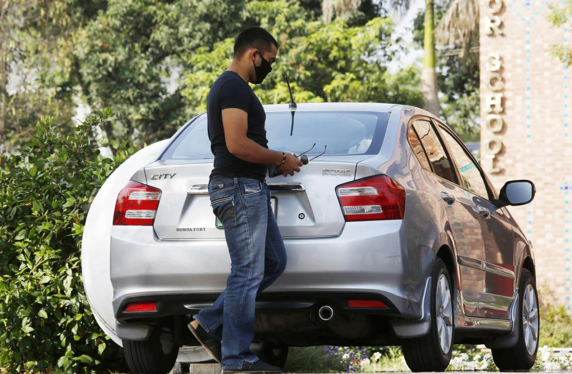 Pakistani Test cricketer Umar Akmal leaves the Pakistan Cricket Board office in Lahore, Pakistan, Monday, April 27, 2020. Akmal has been banned for three years from all forms of cricket. (AP Photo)