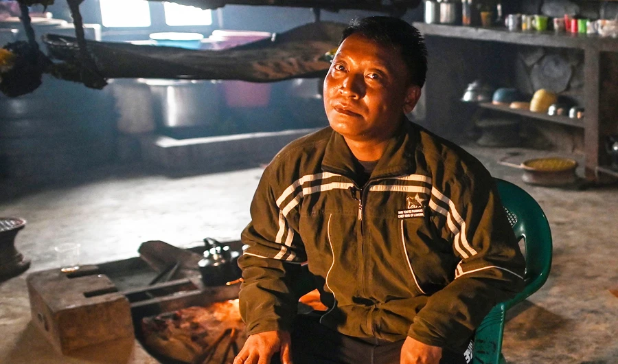 This photo taken on February 8, 2020 shows Tonyei Phawng, king of the Konyak tribe, talking to AFP during an interview inside his home in Longwa village in Myanmar's Sagaing region, near the border with India. (AFP)
