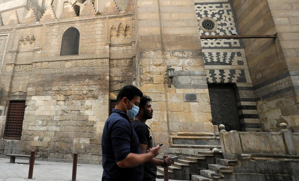 Pedestrians, in the build-up to Ramadan, on al-Muizz street, in the Old Cairo quarter of the Egyptian capital. (Reuters)