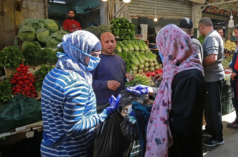 Despite the decline in the number of coronavirus cases in the country, Jordan will require support to maintain efforts to ensure the outbreak is properly contained and avoid a new surge in numbers as the country begins to relax its strict measures. (File/AFP)
