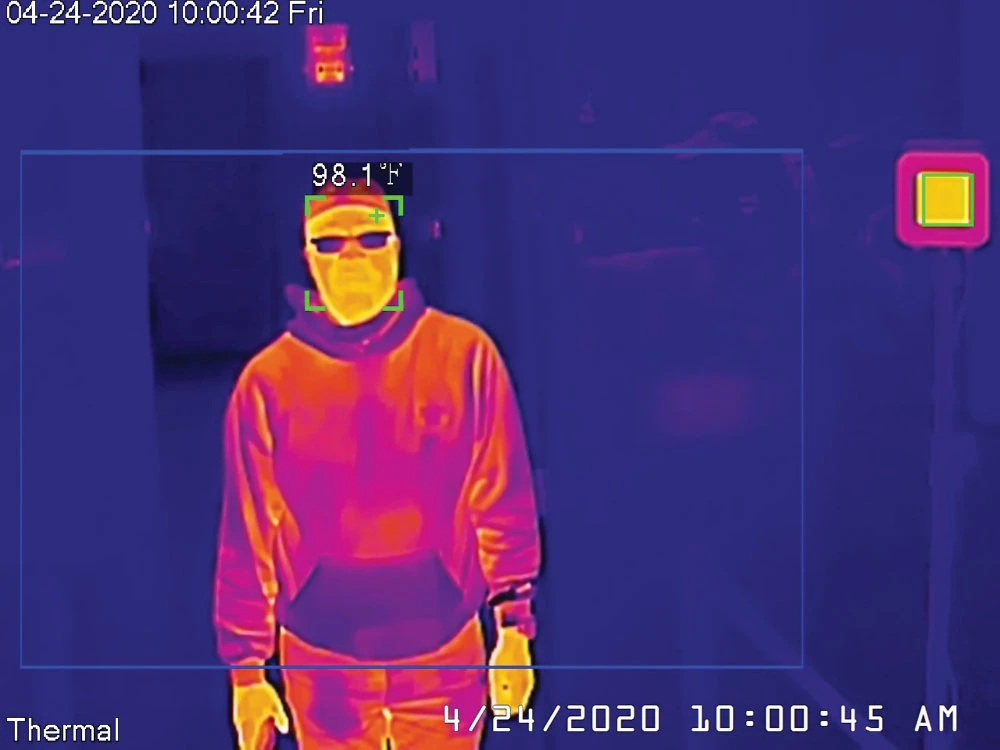 A Dahua thermal camera takes a man’s temperature during a demonstration of the technology in the US. (Reuters)
