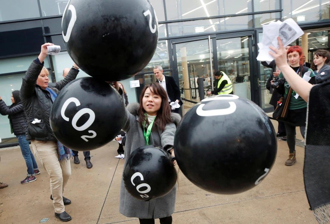 The slump in global energy demand would lead to a drop in carbon dioxide emissions of 8 percent, the IEA said. Above, climate activists protest during the COP23 UN Climate Change Conference in Bonn, Germany on November 17, 2017. (Reuters)