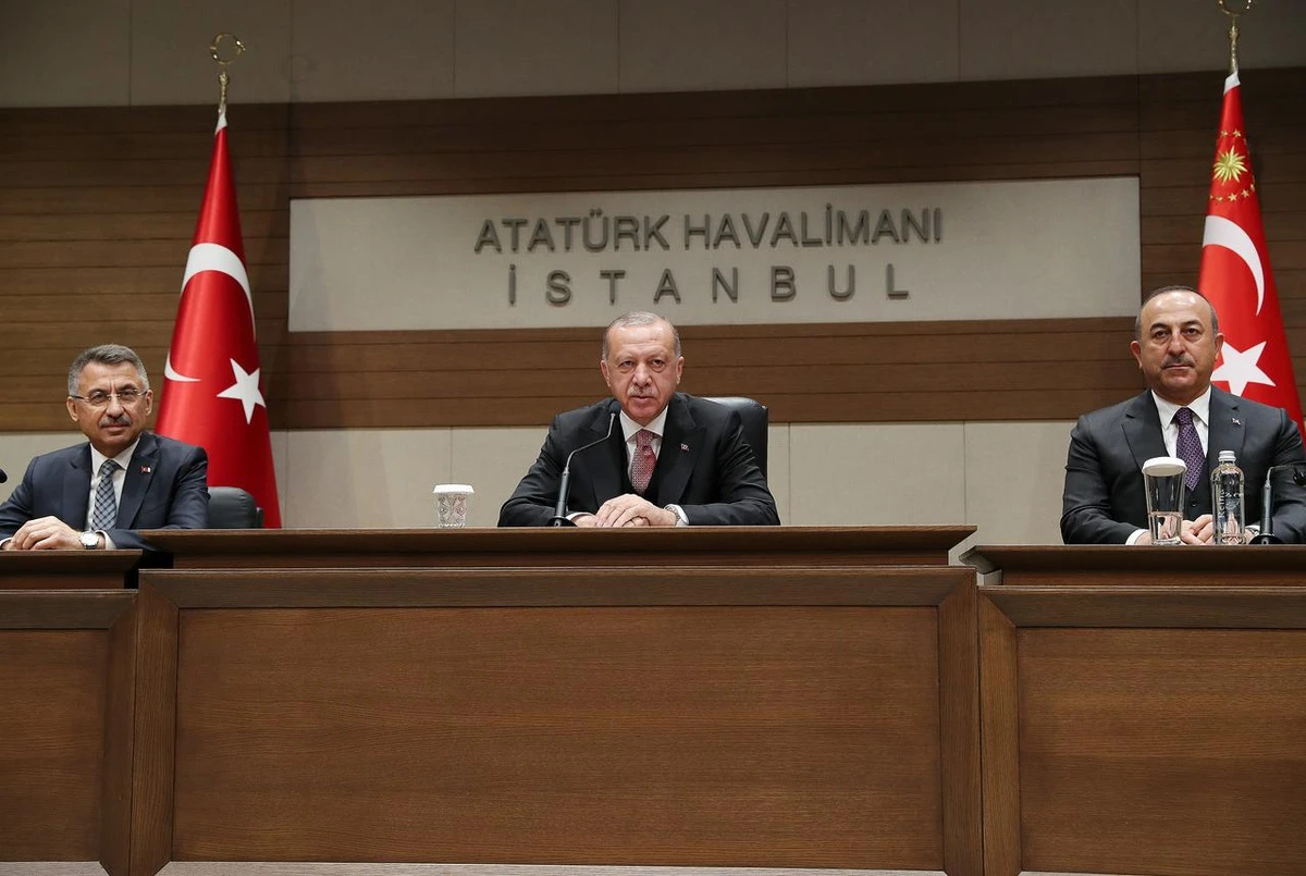 Turkish President Tayyip Erdogan, centre, Vice President Fuat Oktay, left, and Foreign Minister Mevlut Cavusoglu, during a news conference at Ataturk International Airport, in Istanbul. (Reuters)